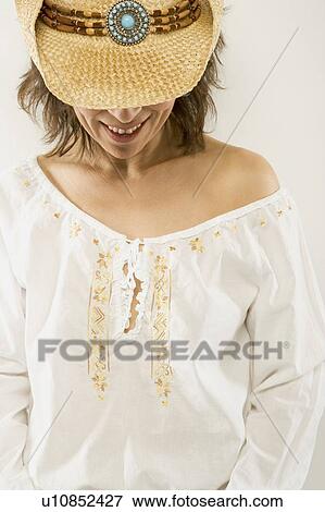 Stock Photo - Woman in cowboy hat. Fotosearch