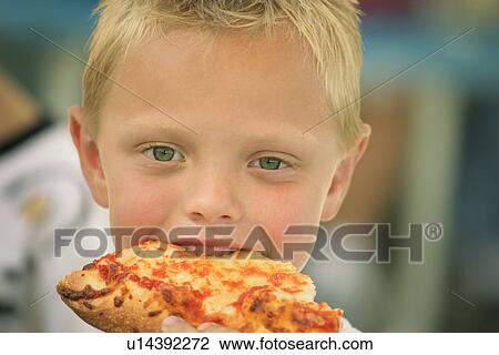 Boy eating pizza View Large Photo Image Stock Image - Boy eating pizza. Fotosearch