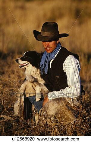 Cowboy with his dog View Large Photo Image Stock Image - Cowboy with his dog. Fotosearch