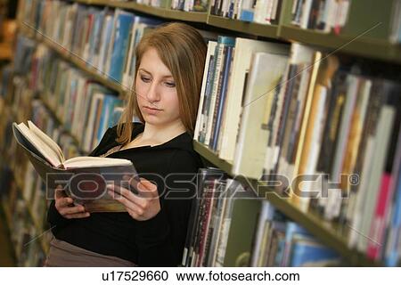 Teen in a library View Large Photo Image Stock Image - Teen in a library. Fotosearch