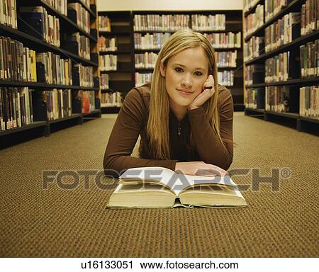 Teen in the library View Large Photo Image Stock Image - Teen in the library. Fotosearch