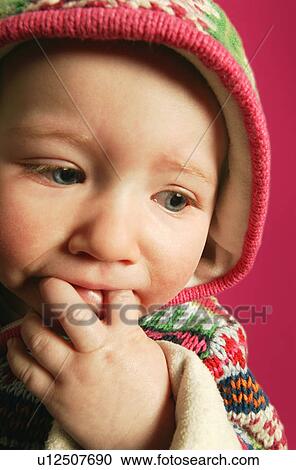 A baby with fingers in mouth View Large Photo Image Stock Image - A baby with fingers in mouth. Fotosearch
