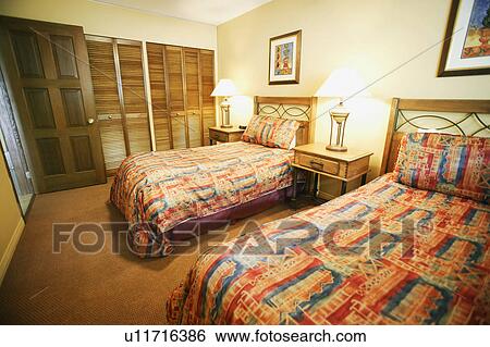 A bedroom with twin beds View Large Photo Image Stock Photograph - A bedroom with twin beds. Fotosearch