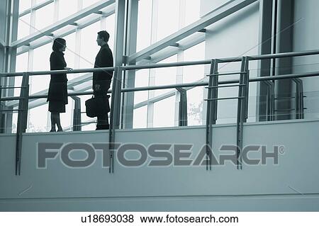 Stock Photo - A business conversation. Fotosearch