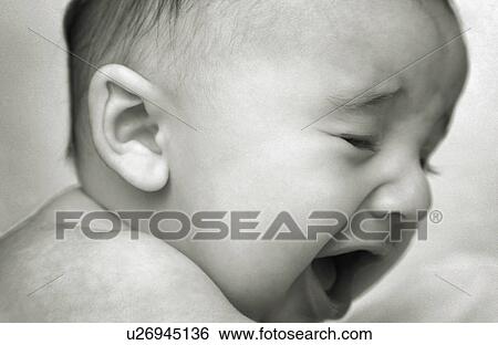 A crying baby View Large Photo Image Stock Photograph - A crying baby. Fotosearch