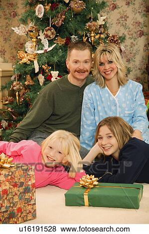 Stock Photo - A family at Christmas. Fotosearch