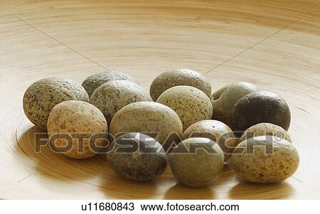 Stock Image - A group of smooth speckled stones. Fotosearch