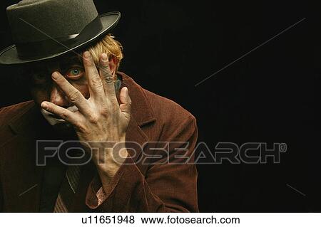 Stock Photo - A hiding clown. Fotosearch