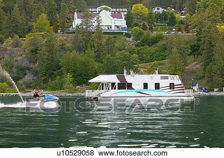 A houseboat and a sea-doo View Large Photo Image Stock Photo - A houseboat and a sea-doo. Fotosearch