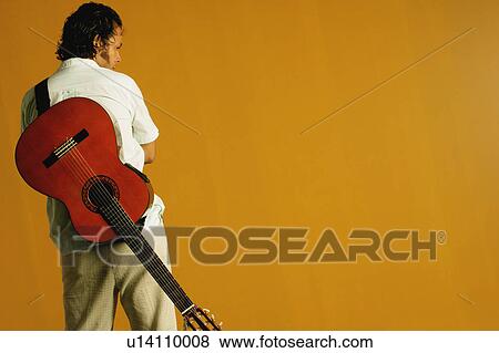 Stock Photo - A man with a guitar. Fotosearch