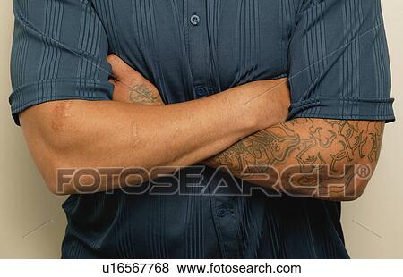 A man with a tattoo View Large Photo Image Stock Photo - A man with a tattoo. Fotosearch