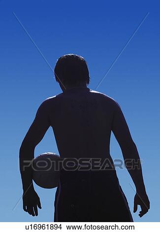 Picture - A man with a volleyball. Fotosearch