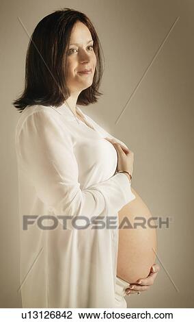 A pregnant belly View Large Photo Image Stock Image - A pregnant belly. Fotosearch