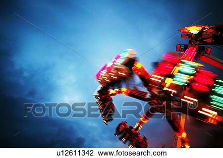 A ride at an amusement park View Large Photo Image Stock Image - A ride at an amusement park. Fotosearch