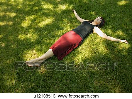 Stock Image - A woman relaxing. Fotosearch
