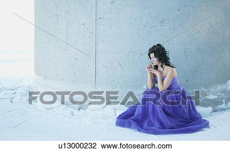 Stock Image - A woman with a blue gown. Fotosearch