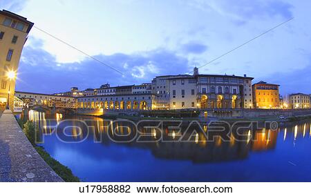 Stock Image - Arno River at Dusk Ponte Vecchio Florence Tuscany Italy . Fotosearch