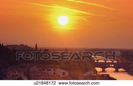 Stock Image - Arno River at Dusk Ponte Vecchio Florence Tuscany Italy . Fotosearch
