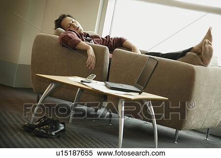 Asleep on the sofa View Large Photo Image Stock Photography - Asleep on the sofa. Fotosearch