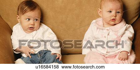 Stock Photo - Babies sitting together. Fotosearch