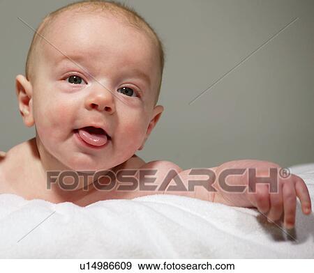 Baby hanging out on tummy View Large Photo Image Stock Photo - Baby hanging out on tummy. Fotosearch