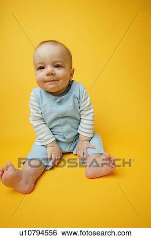 Baby sits View Large Photo Image Stock Photograph - Baby sits. Fotosearch