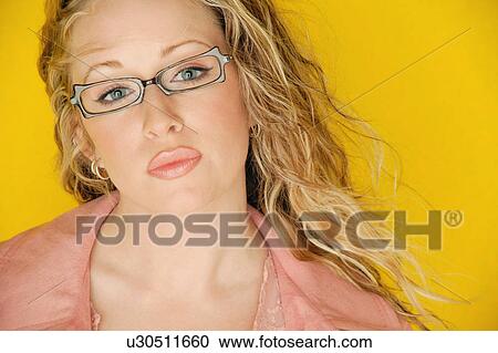 Stock Image - Beautiful model wearing trendy glasses. Fotosearch