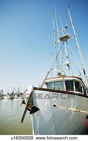 Stock Photo - Boat in a harbor. Fotosearch
