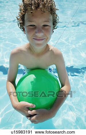 Stock Image - Boy in swimming pool. Fotosearch