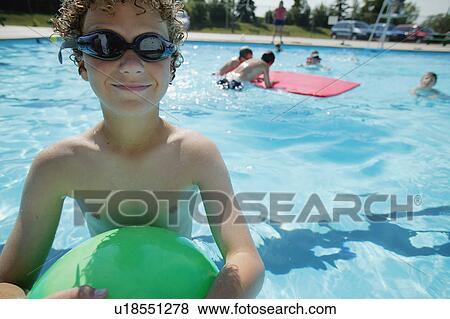 Boy in swimming pool View Large Photo Image Stock Photo - Boy in swimming pool. Fotosearch