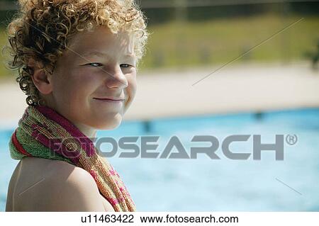 Boy sits beside the pool View Large Photo Image Stock Image - Boy sits beside the pool. Fotosearch