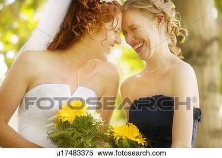 Bride and bridesmaid share memories View Large Photo Image Stock Photography - Bride and bridesmaid share memories. Fotosearch