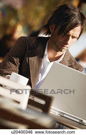 Businessman at computer View Large Photo Image Stock Photo - Businessman at computer. Fotosearch