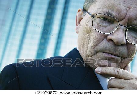 Businessman experiences stress View Large Photo Image Stock Image - Businessman experiences stress. Fotosearch