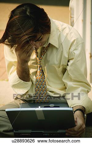Businessman feels exhausted View Large Photo Image Stock Photograph - Businessman feels exhausted. Fotosearch