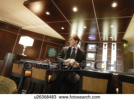 Businessman with a cup of coffee View Large Photo Image Stock Image - Businessman with a cup of coffee. Fotosearch
