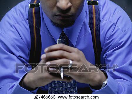 Stock Image - Businessman with focus. Fotosearch