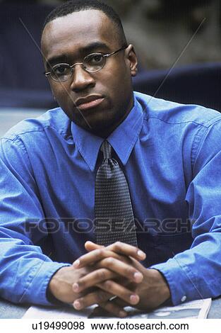 Stock Photo - Businessman with folded hands. Fotosearch