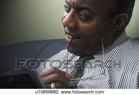 Businessman with glasses in hand View Large Photo Image Stock Image - Businessman with glasses in hand. Fotosearch