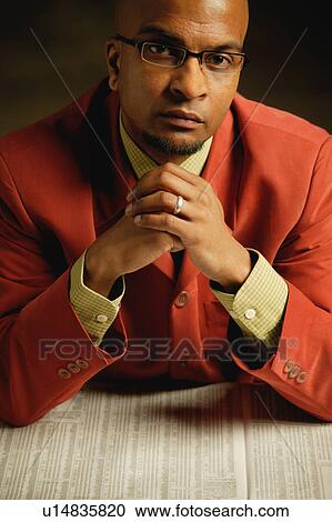 Stock Image - Businessman with newspaper. Fotosearch