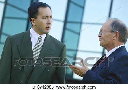 Businessmen have a discussion View Large Photo Image Stock Photography - Businessmen have a discussion. Fotosearch