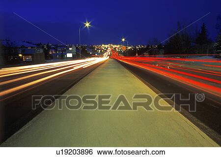 Cars driving at night View Large Photo Image Stock Photograph - Cars driving at night. Fotosearch