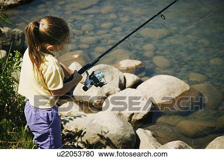 Child fishing on a beach View Large Photo Image Stock Image - Child fishing on a beach. Fotosearch
