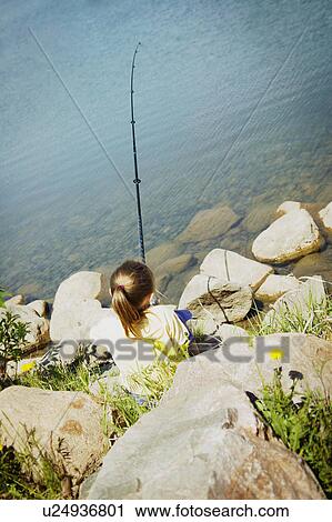 Child fishing on a beach View Large Photo Image Stock Image - Child fishing on a beach. Fotosearch