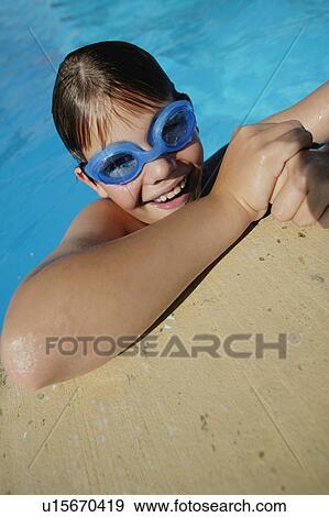 Child in swimming pool View Large Photo Image Stock Photo - Child in swimming pool. Fotosearch