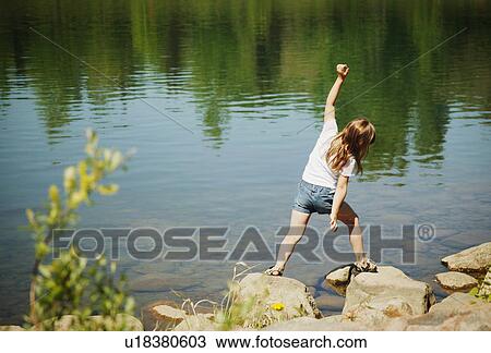 Child plays on a beach View Large Photo Image Stock Image - Child plays on a beach. Fotosearch