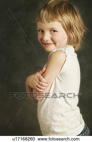 Child rolls up her sleeves View Large Photo Image Stock Image - Child rolls up her sleeves. Fotosearch