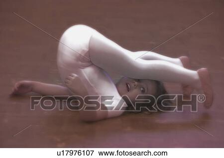 Child stretches in dance class View Large Photo Image Stock Photo - Child stretches in dance class. Fotosearch