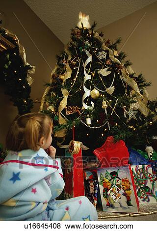 Child waits for Christmas View Large Photo Image Stock Photo - Child waits for Christmas. Fotosearch