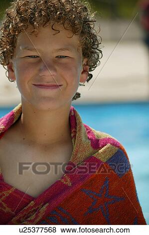 Stock Photo - Child with a beach towel. Fotosearch